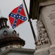 The Confederate flag flies on the Statehouse grounds in Columbia, S.C., June 23, 2015, one day after South Carolina Gov. Nikki Haley announced that she will call for the Confederate flag to be removed.
Win McNamee/Getty Images